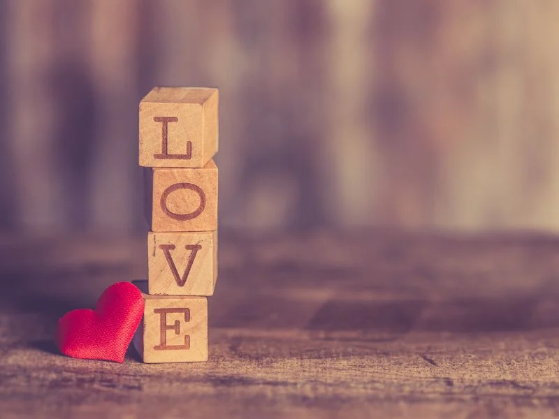 stack of blocks with the letters L-O-V-E on them.