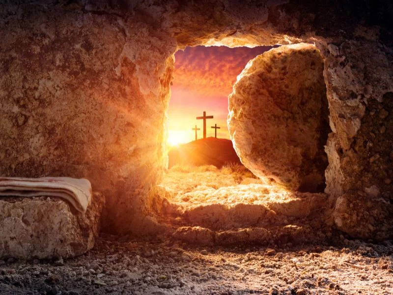 empty tomb and crosses at sunset
