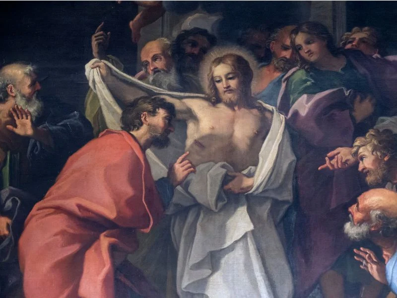 Doubting Thomas examines Jesus' side.