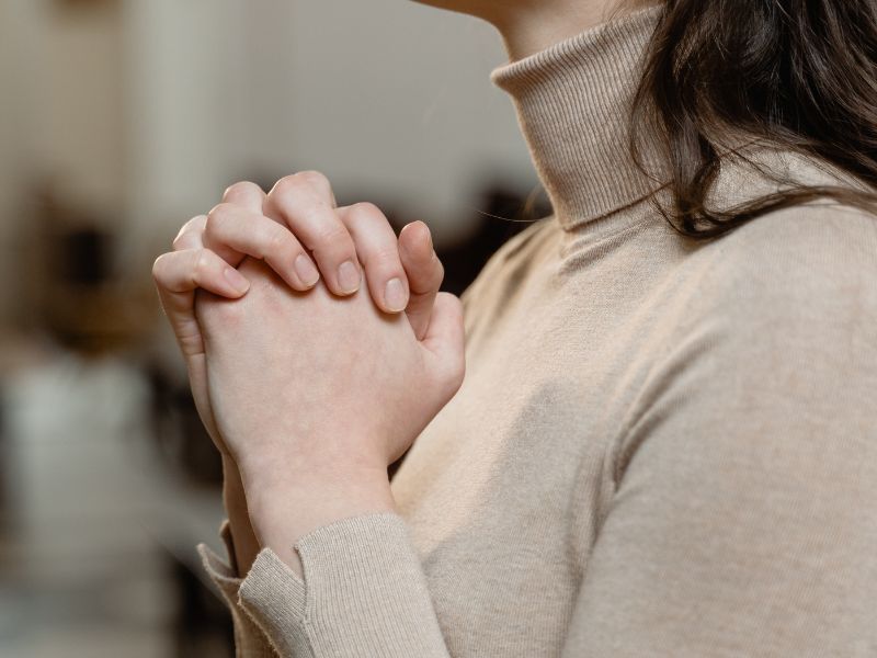 Fearful woman praying