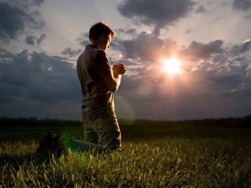 Man kneeling in prayer