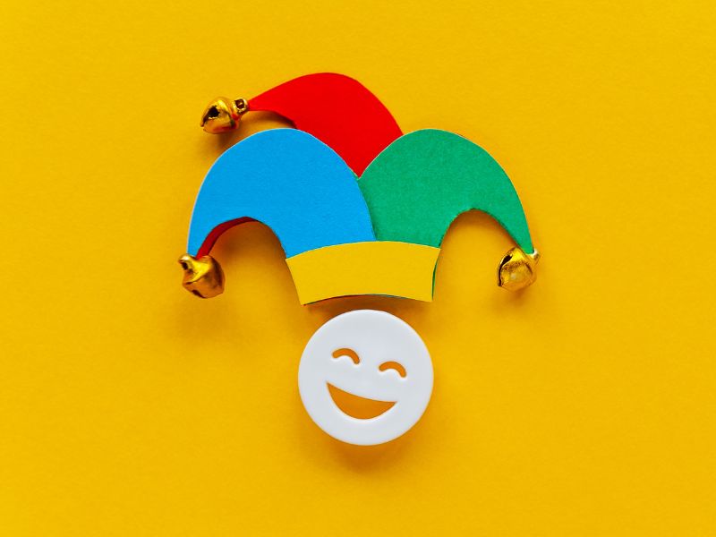 happy face wearing a jester's hat